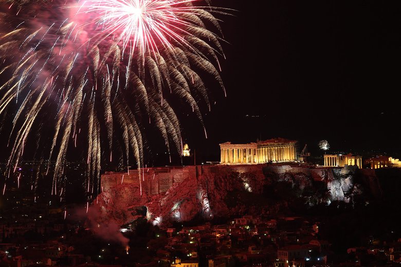 Athens’ ancient Parthenon temple on the Acropolis Hill is lit up for the celebrations of the New Year. Photograph: Simela Pantzartzi/EPA