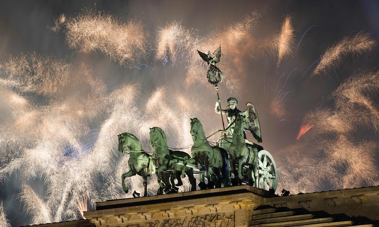Fireworks explode next to the Quadriga sculpture on the Brandenburg gate during New Year celebrations in Berlin, Germany. Photograph: Odd Andersen/AFP/Getty Images