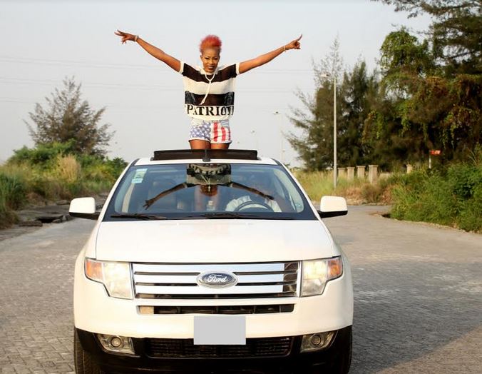 Alizee pose for a picture with her brand new car.