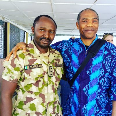 In company of one of the military officers attached to the camp.