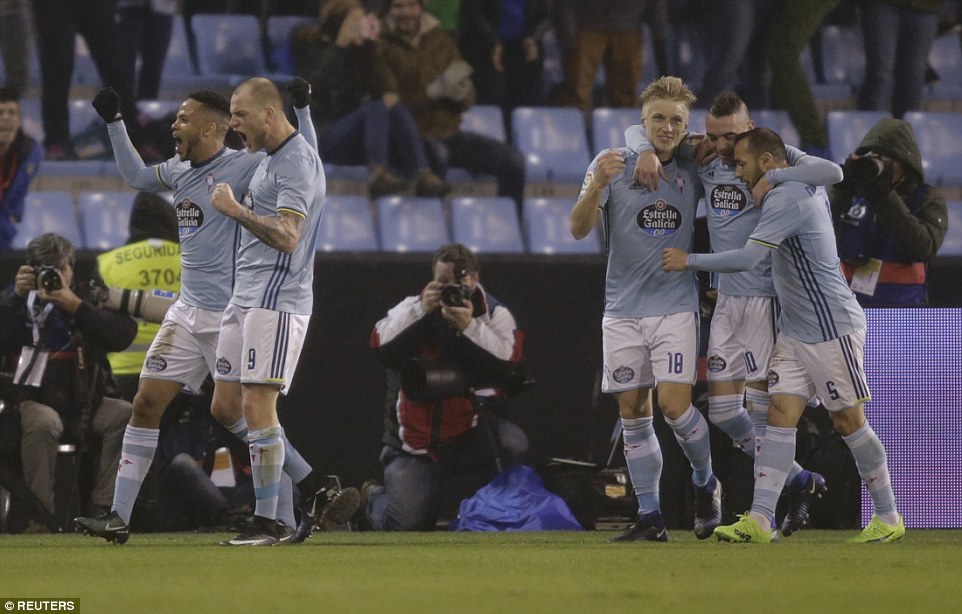 John Guidetti celebrates with his Celta Vigo team-mate.