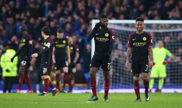 Kelechi Iheanacho and Raheem Sterling walk off the pitch following their team's 4-0 defeat. Credit: Alex Livesey/Getty Images