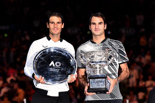 Nadal and Federer with their trophies. Photo: Ben Solomon/Tennis Australia