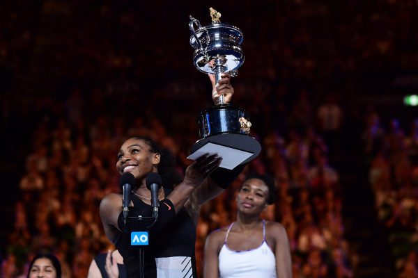 Serena lifts the Australian Open trophy after beating Venus. Photo: Ben Solomon/Tennis Australia