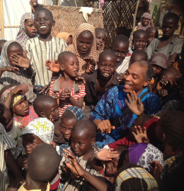 Femi Kuti bonding with children at the IDP camp in Borno.