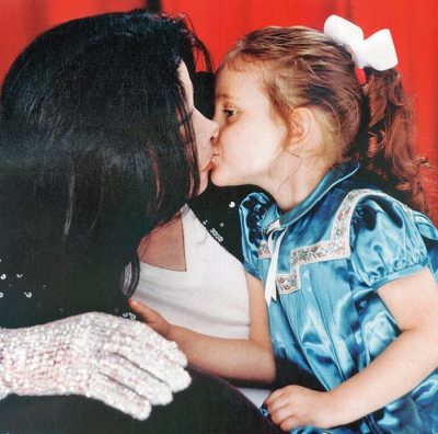 This is one of the rare occasions that her face was seen as a child. Michael normally covered his children's faces.