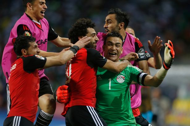Egypt players celebrate after beating Burkina Faso on penalties. Credit: Reuters