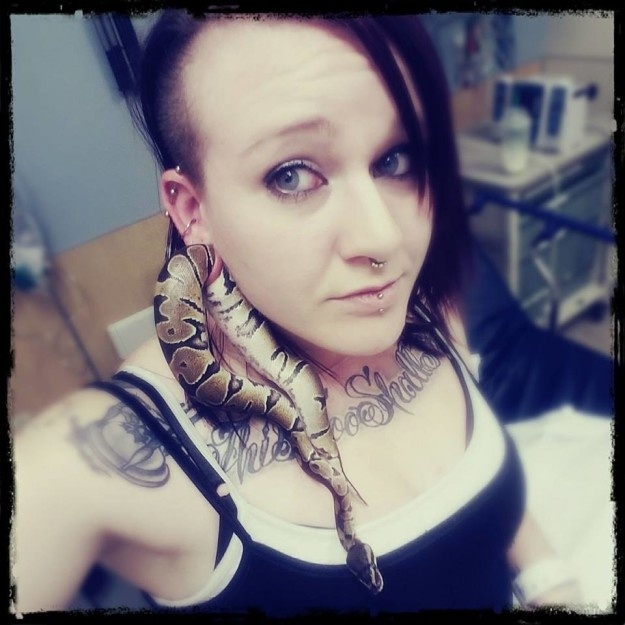 Ashley Glawe had her snake pet stuck in her earlobe. Photo: Facebook