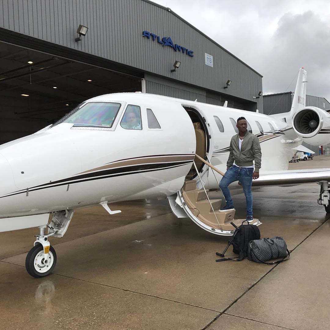 Dammy Krane posing before boarding the private jet.