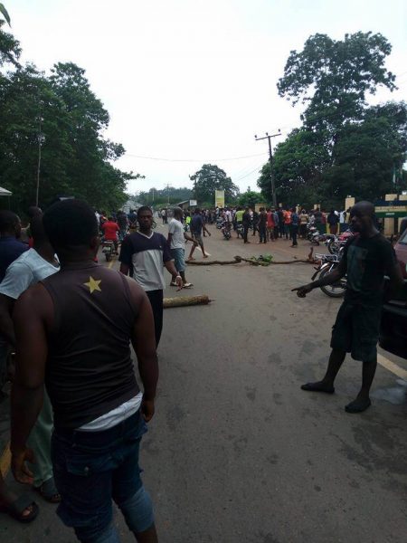 People protesting at the roadblock